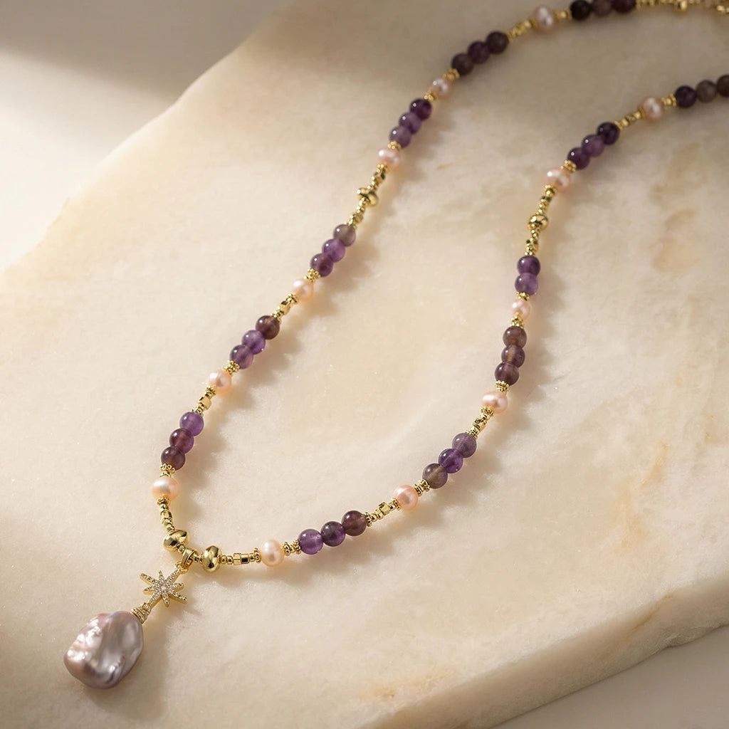 Celestial Reverie Pearl Necklace on a stone slab