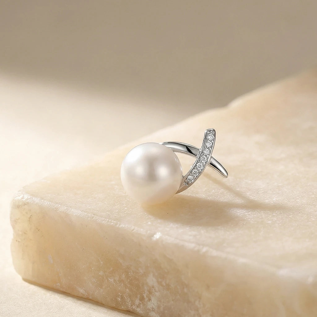crossed light pearl studs on a fabric