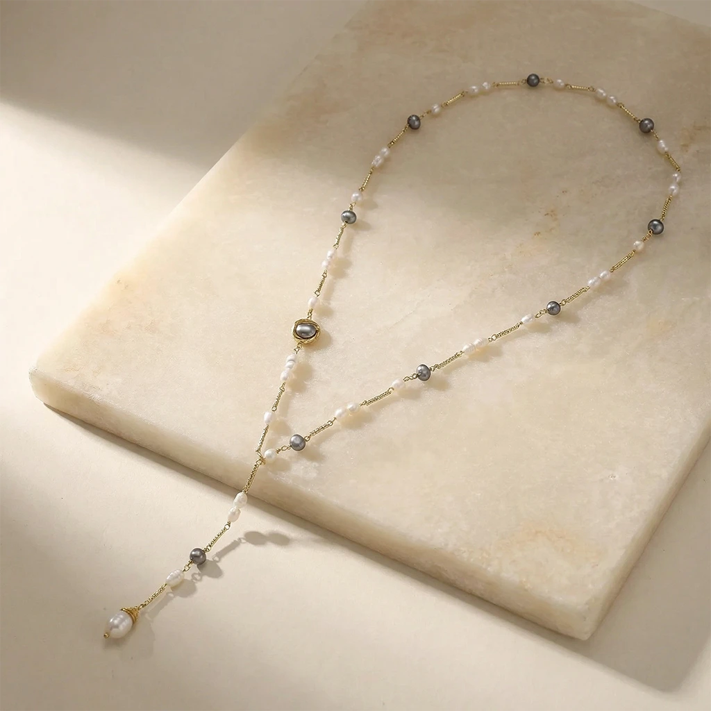 Twilight Pearl Lariat Necklace on a slab