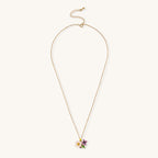 Delicate 18K gold plated necklace featuring colorful enamel flowers in pink and white with green leaves on chain