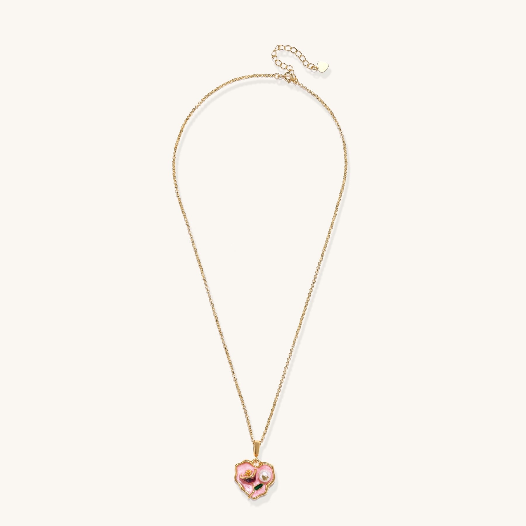 Gold-plated heart pendant necklace with pink enamel rose design and freshwater pearl on adjustable chain