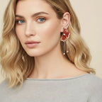 Woman wearing a floral earring with a beige background