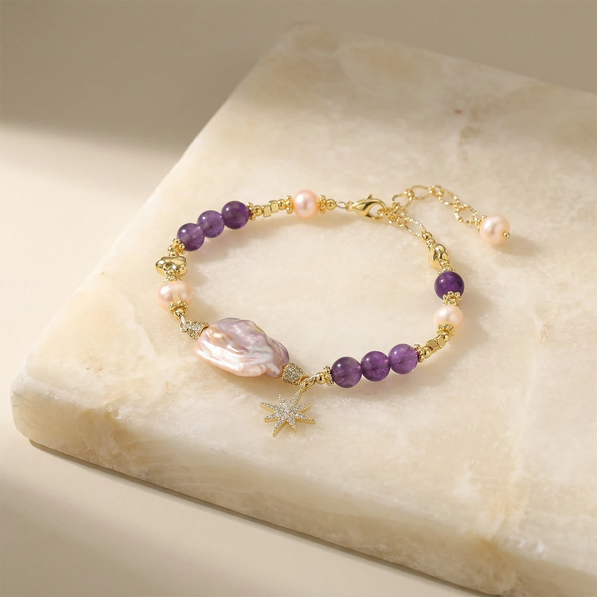 Celestial Baroque Pearl Bracelet on a stone slab