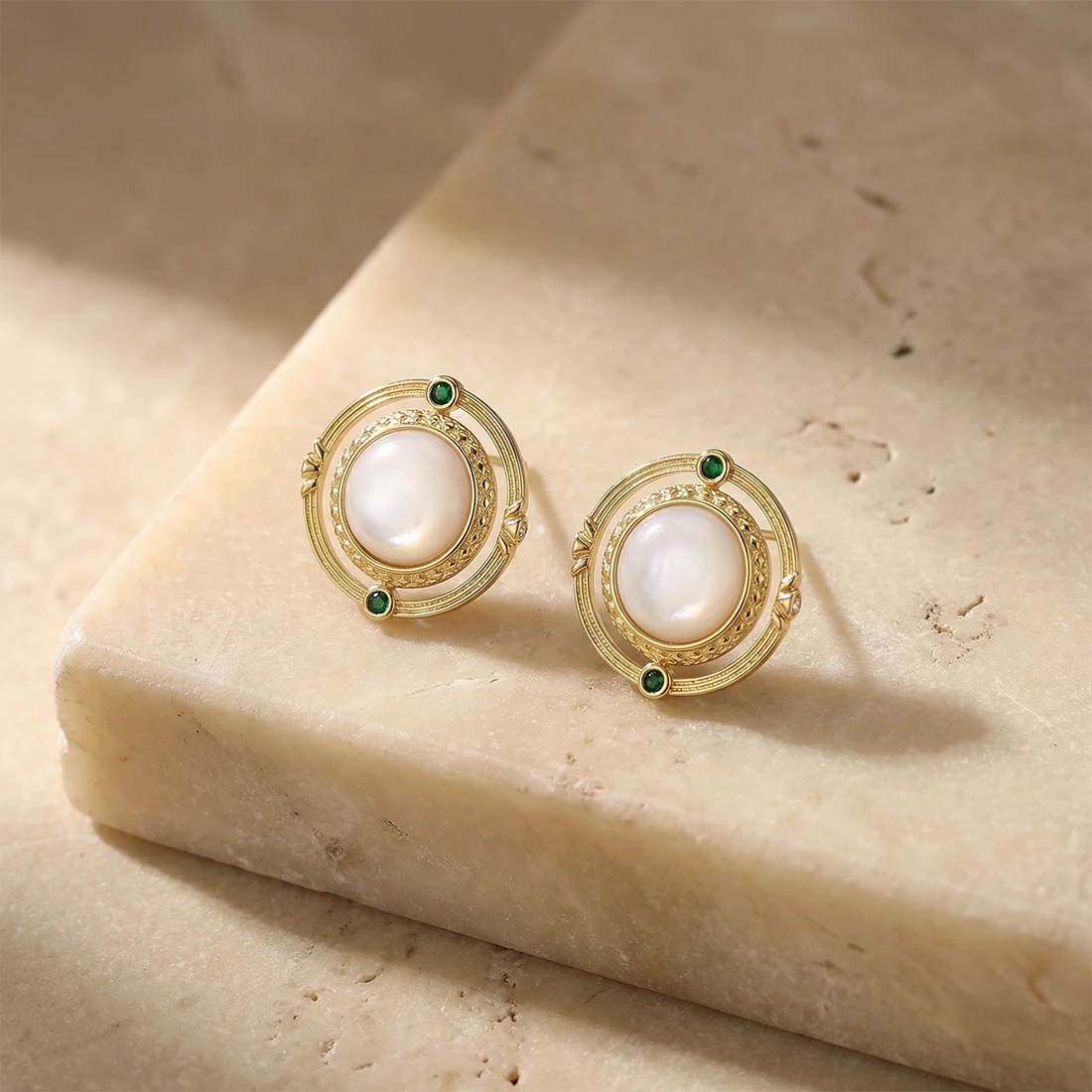 Cosmic Mother of Pearl Earrings on a stone