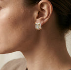 Close-up of an ear wearing the elemental baroque earring