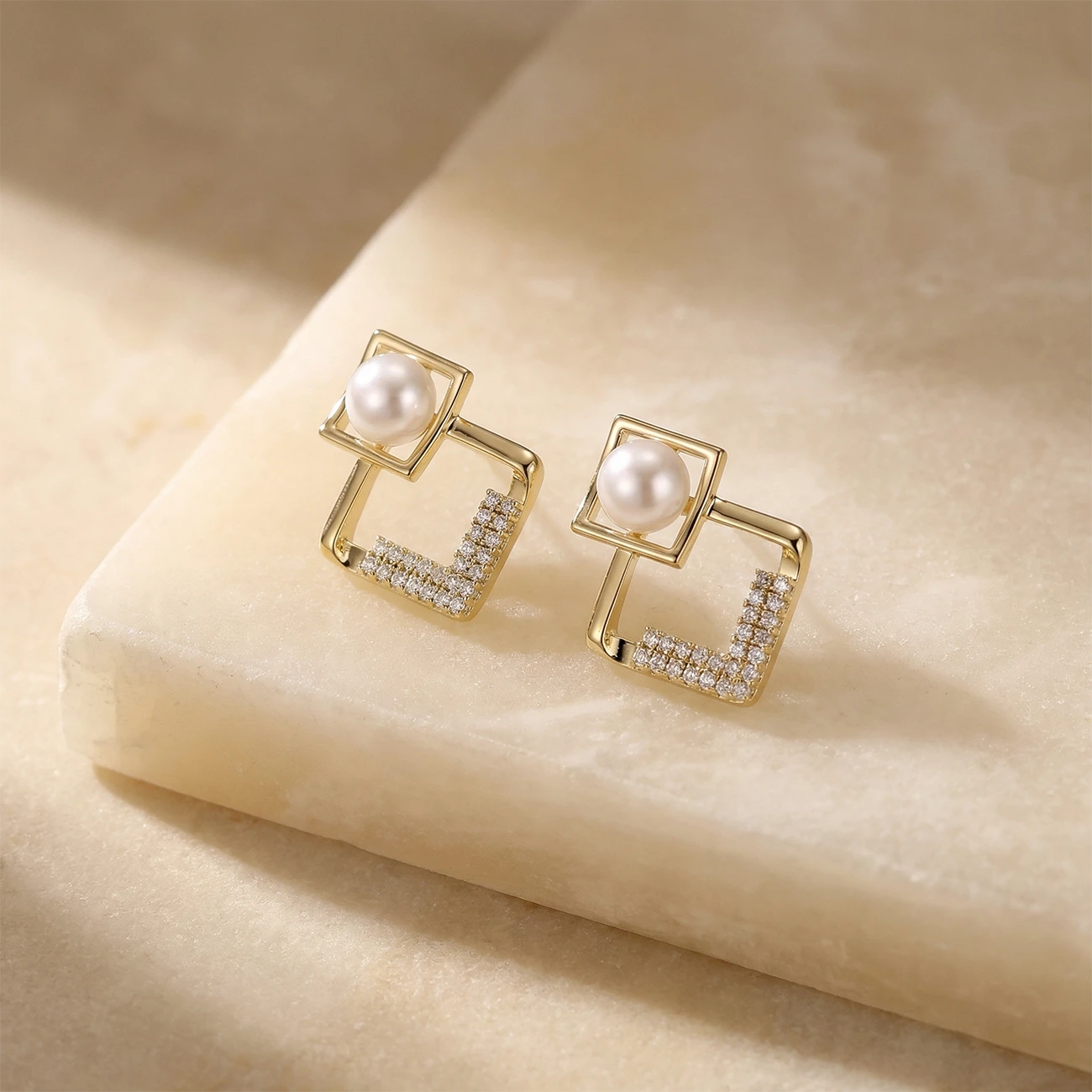 Elemental Pearl Geometry Earrings on a stone