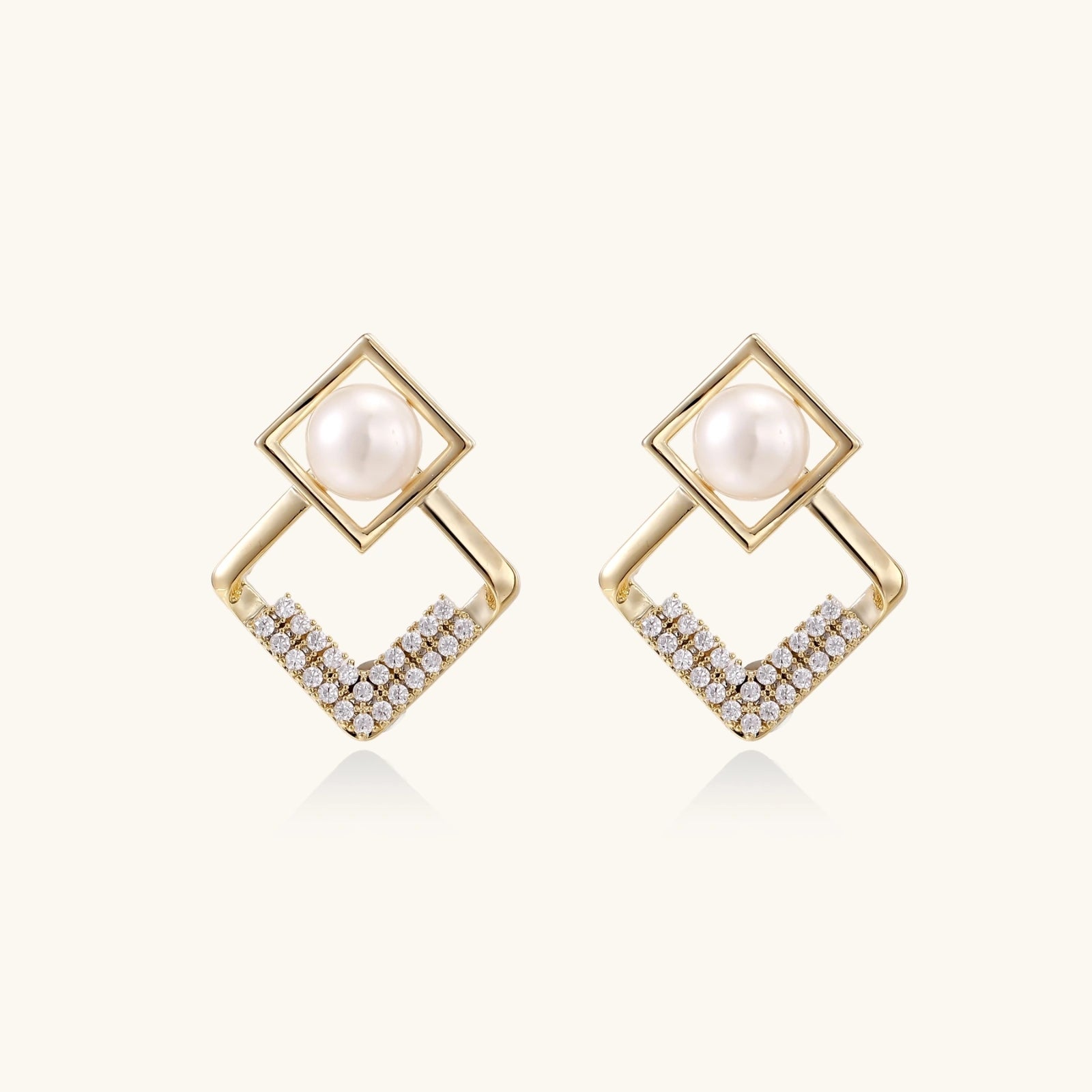 geometric Gold earrings with pearls and small diamonds on a white background