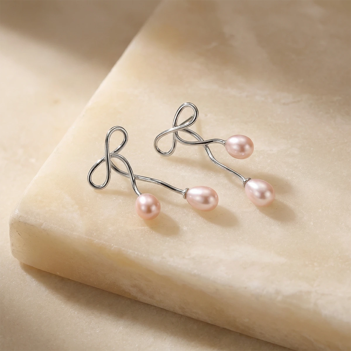 Ethereal Ribbon Pearl Drops on a stone