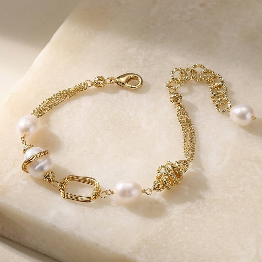 Filigree Path Pearl Bracelet on a marble slab