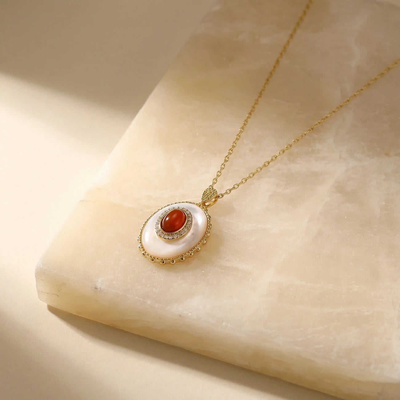 Golden Hour Mother of Pearl Pendant on a stone
