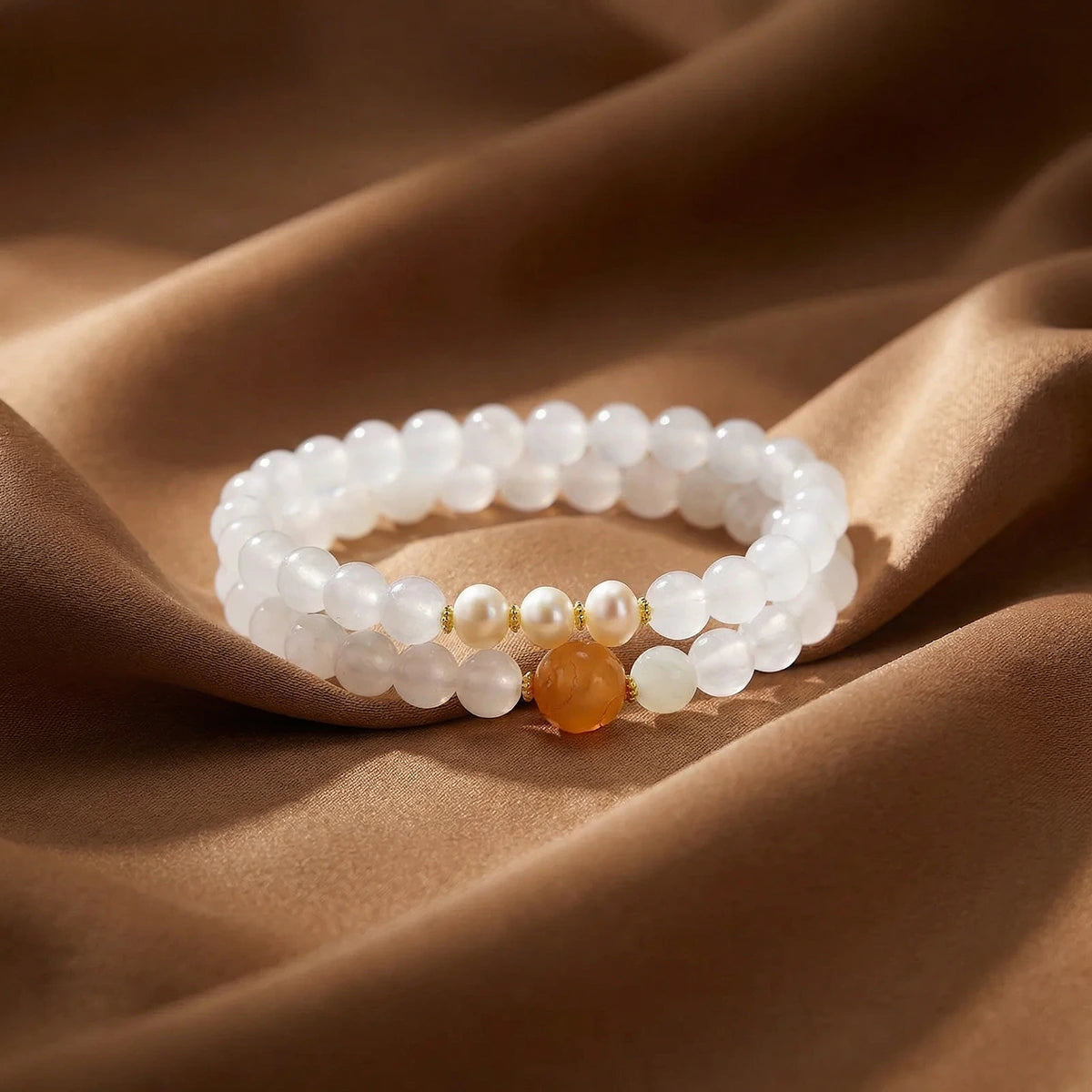 Lotus Jade Pearl Bracelet on a fabric