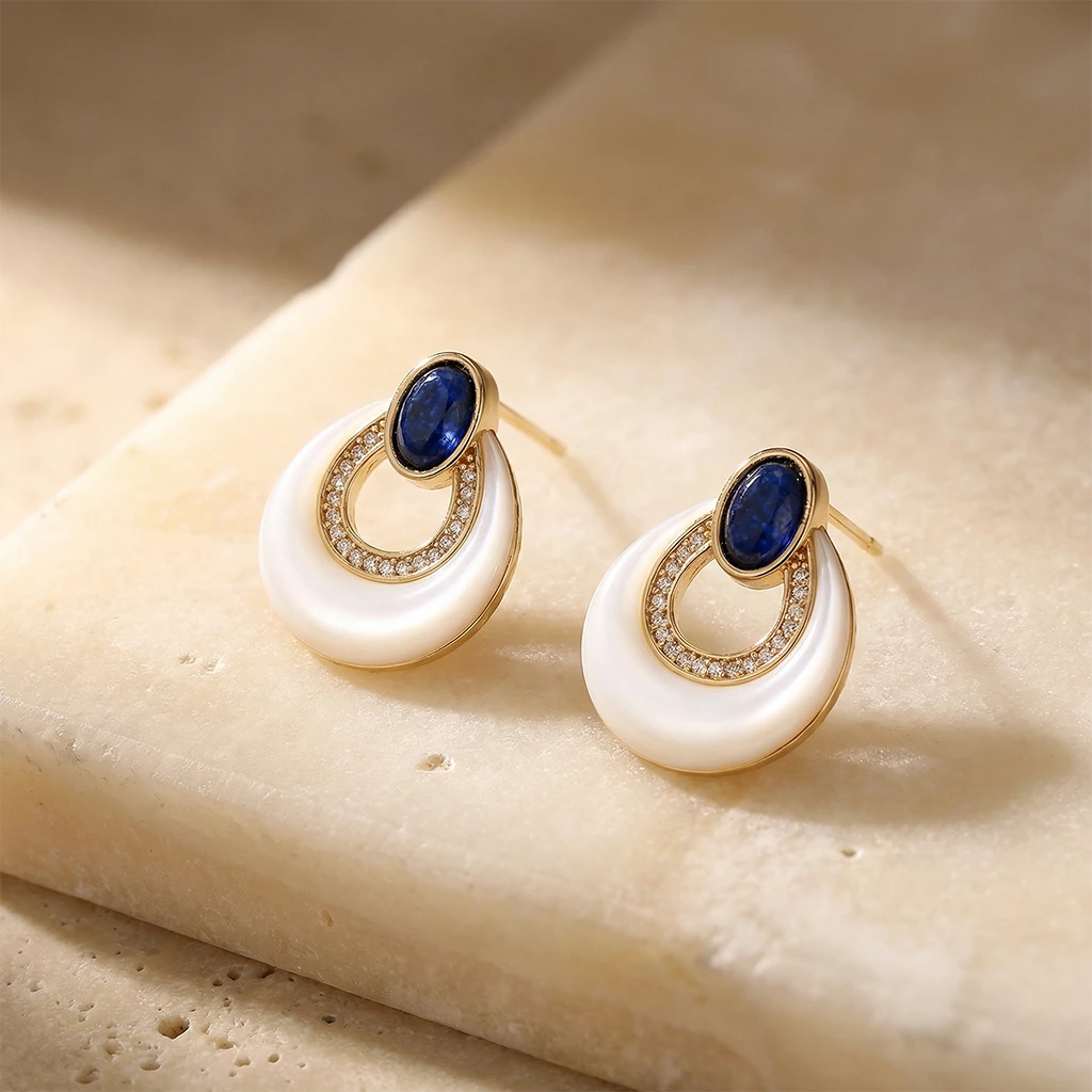 Midnight Tide Pearl Earrings on a stone