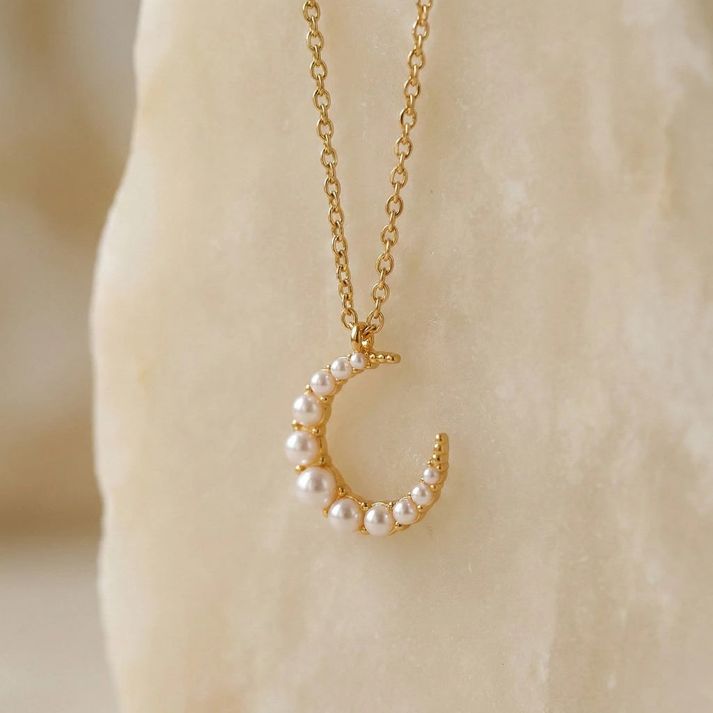 Pearl set on a cresent necklace