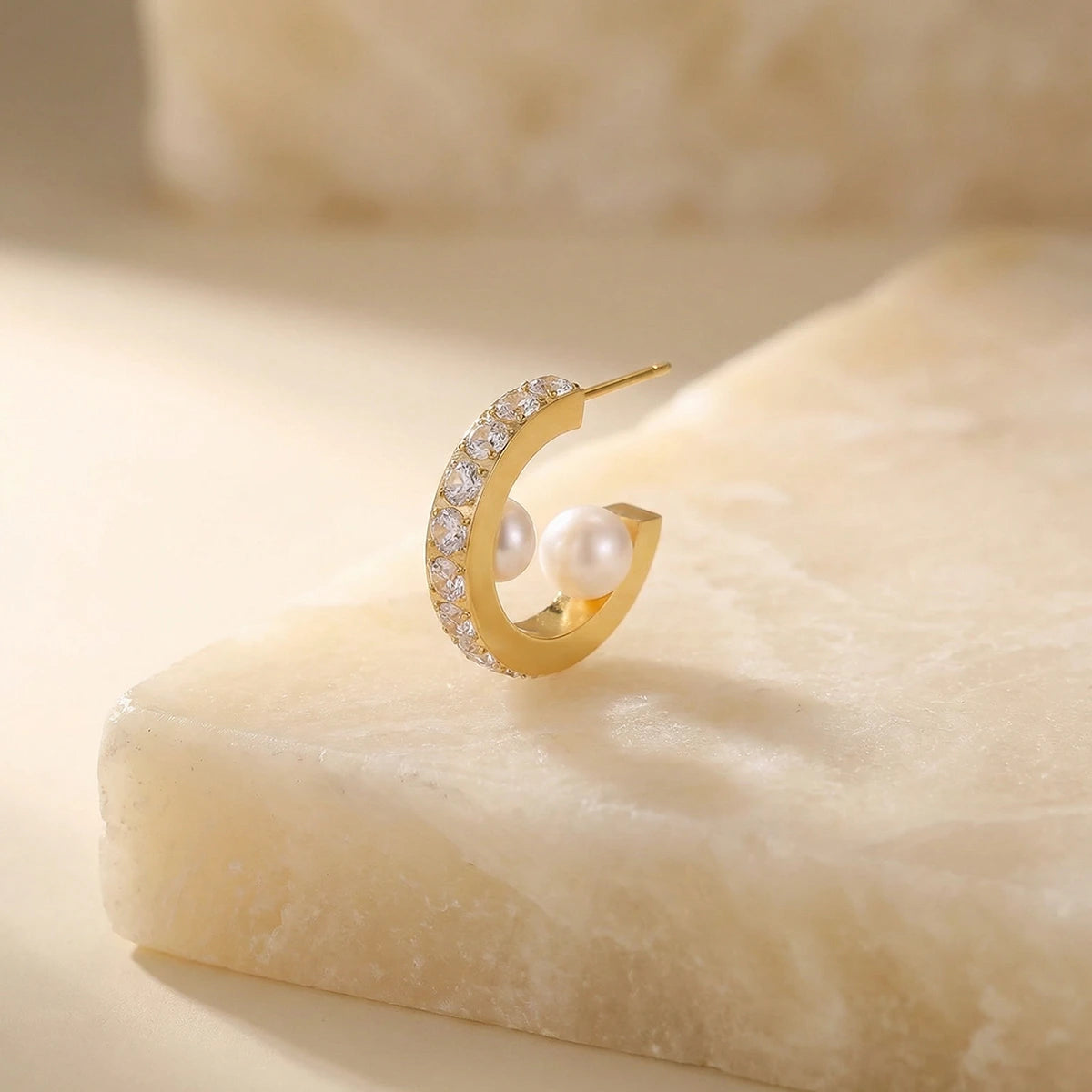 Radiant Pearl Hoop Earrings on a stone slab