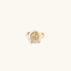Gold-plated sculptural ring featuring a baroque pearl wrapped in a delicate rose and vine cage design