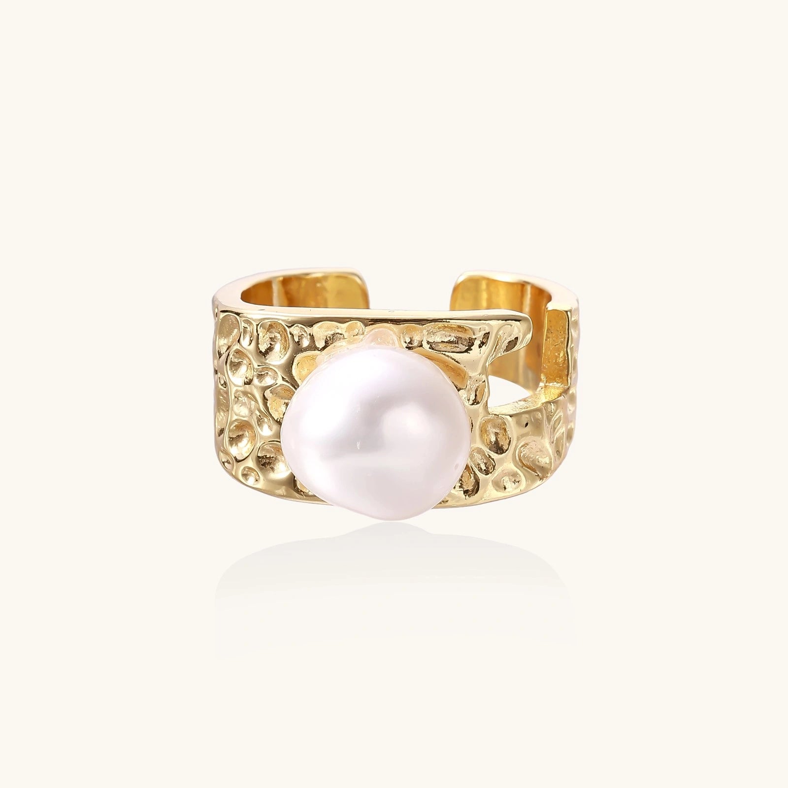 Wide gold-plated ring with organic textured band and white freshwater pearl centerpiece