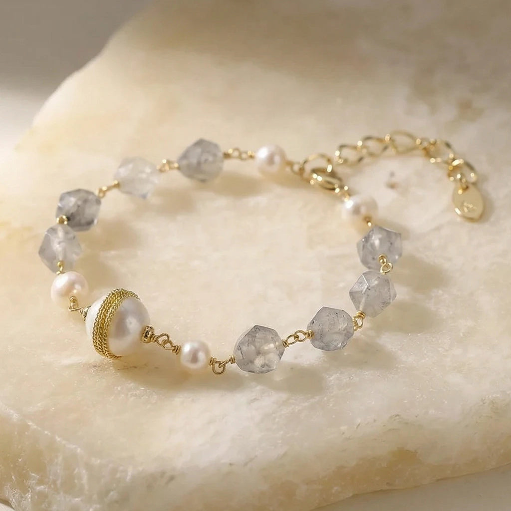 Veiled Clarity Pearl Bracelet on a stone slab